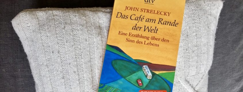 Buchcover von "Das Café am Rande der Welt" von John Strelecky.